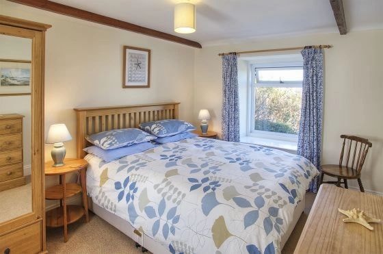 Double bedroom with blue floral linen