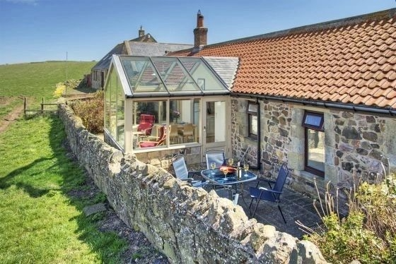 Conservatory and patio overlooking the garden
